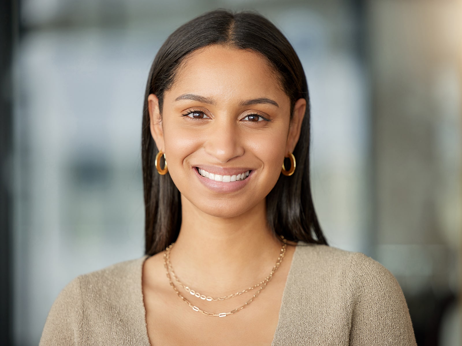 Young Beautiful Woman with Earings Smiling